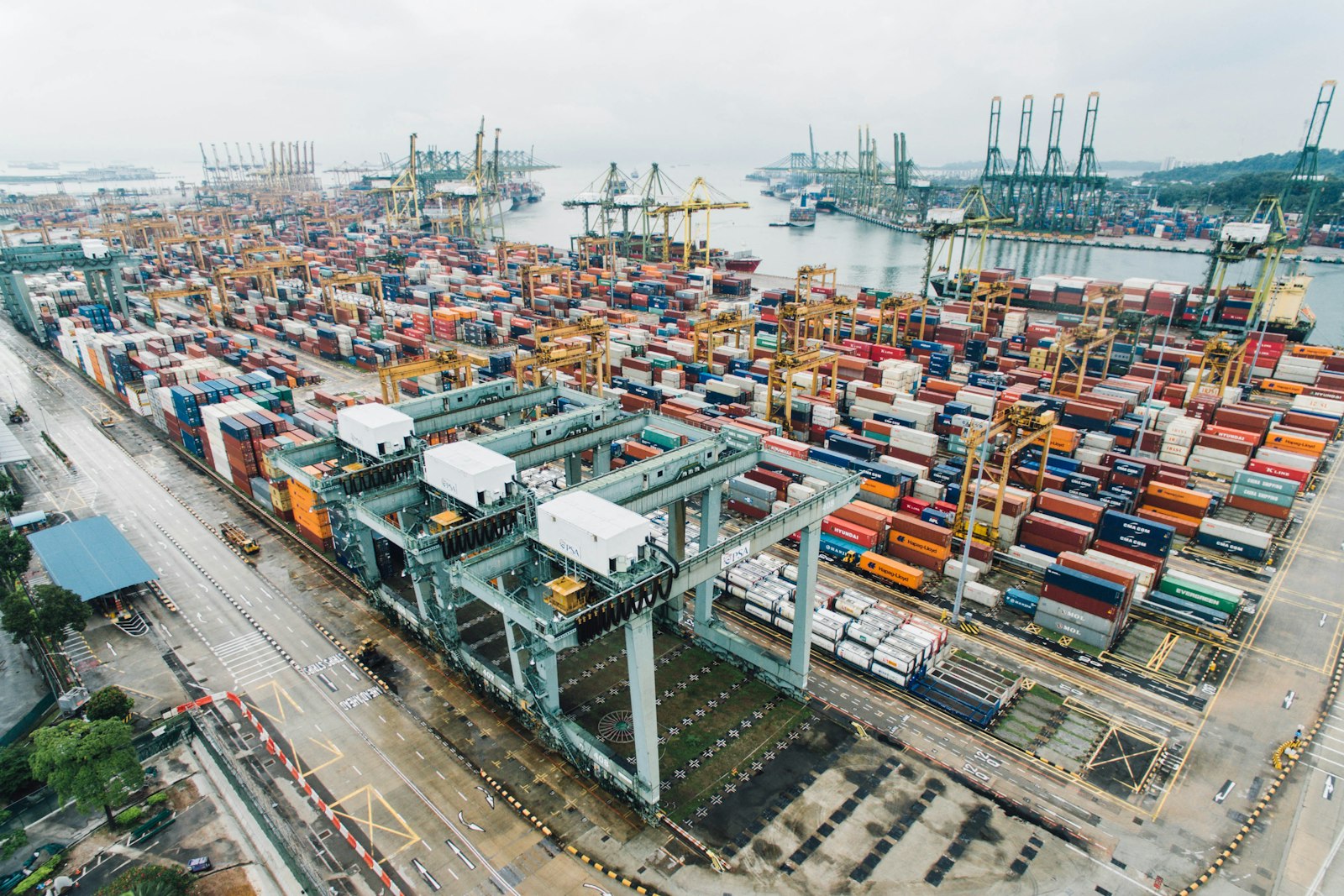 Colorful shipping containers stacked at a terminal